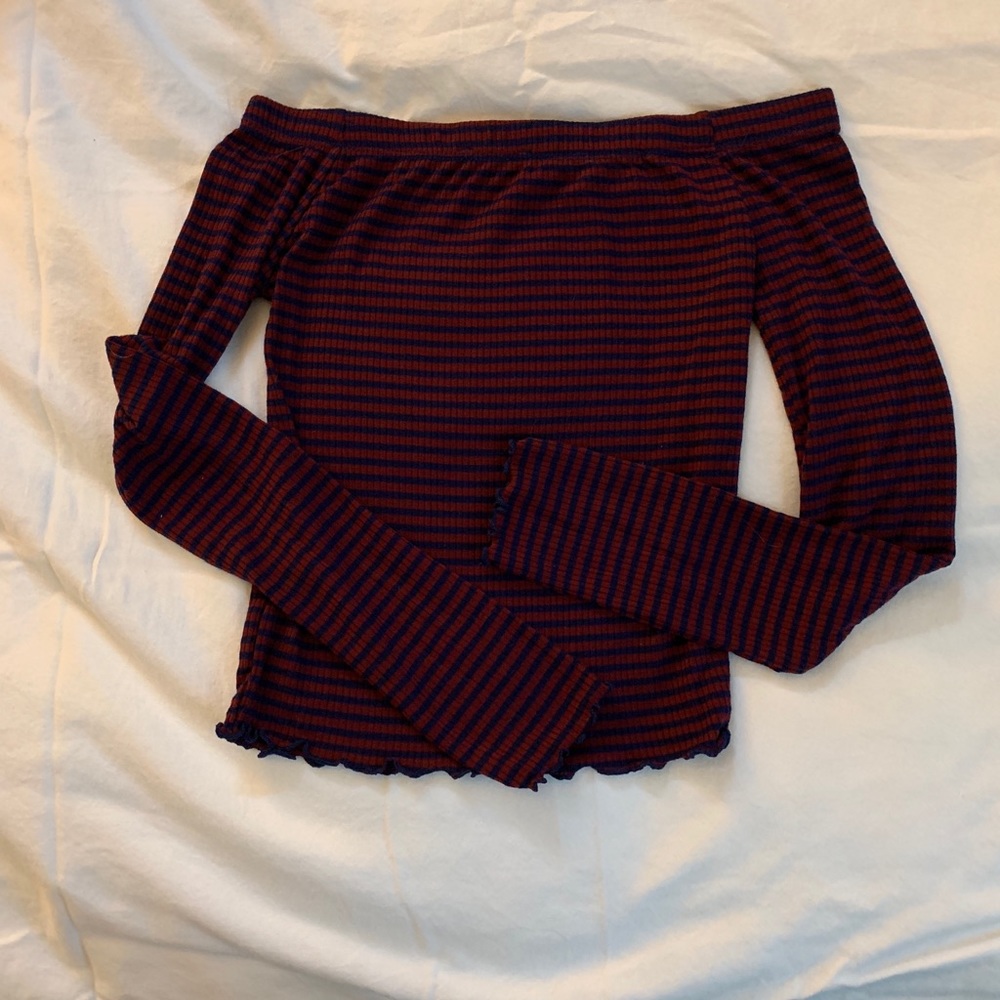 Long sleeved off the shoulder T-shirt.